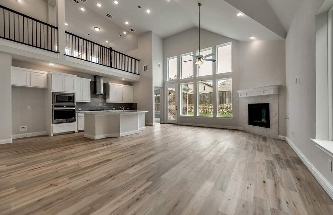 Renovated open-concept great room and kitchen with new plank flooring in a Vaughan home