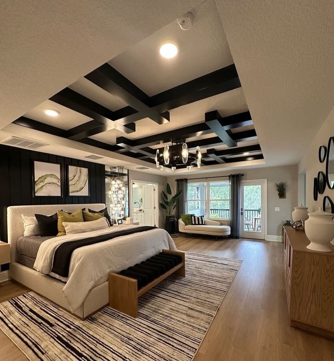 Renovated primary bedroom with tray ceiling and black timber beams in Vaughan